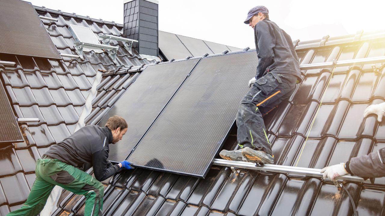 An image of solar panel installer laughing 